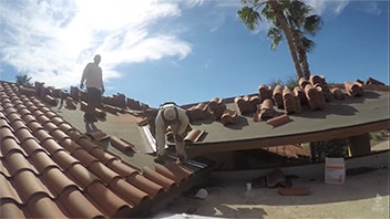 Roofers Installing A New Tile Roof In Arizona