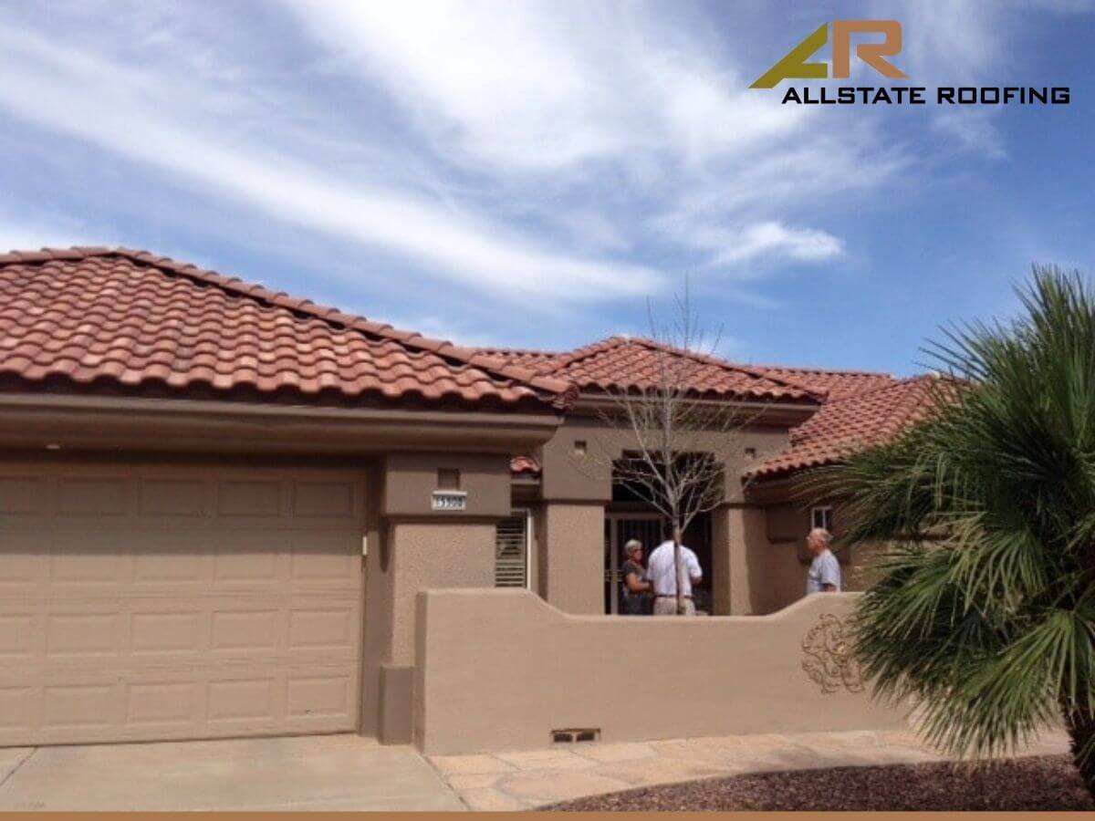 Arizona homeowners inspecting their roof to determine about the roof insurance claim vailidity