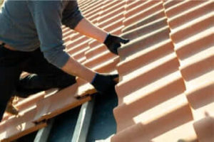 Experienced Roofer Installing A New Shingle Roof On A Home In Arizona