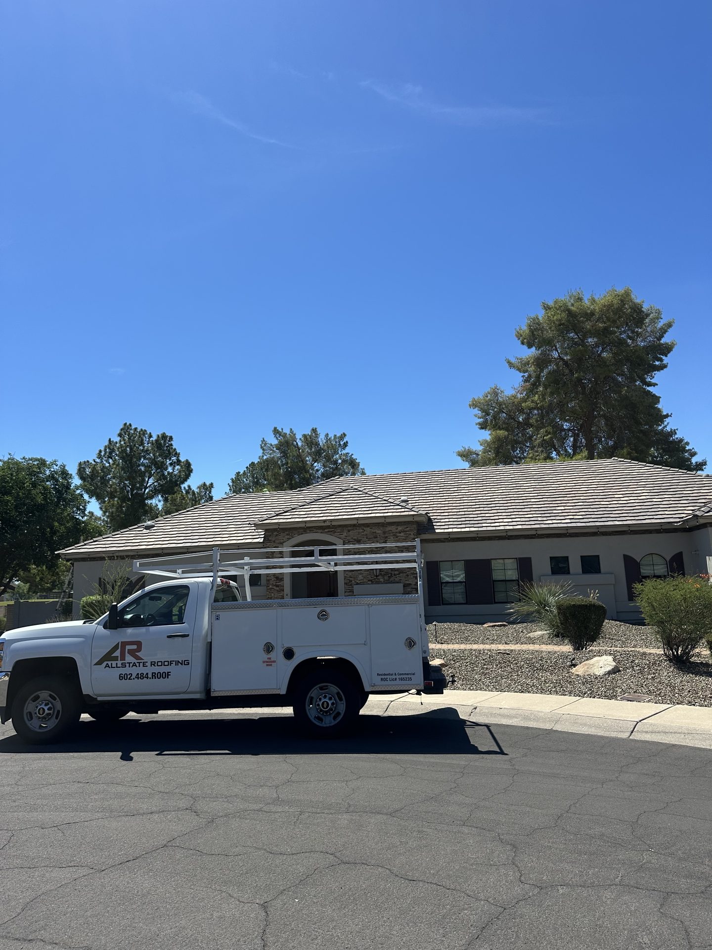 Allstate Roofing service truck at a residential roofing job