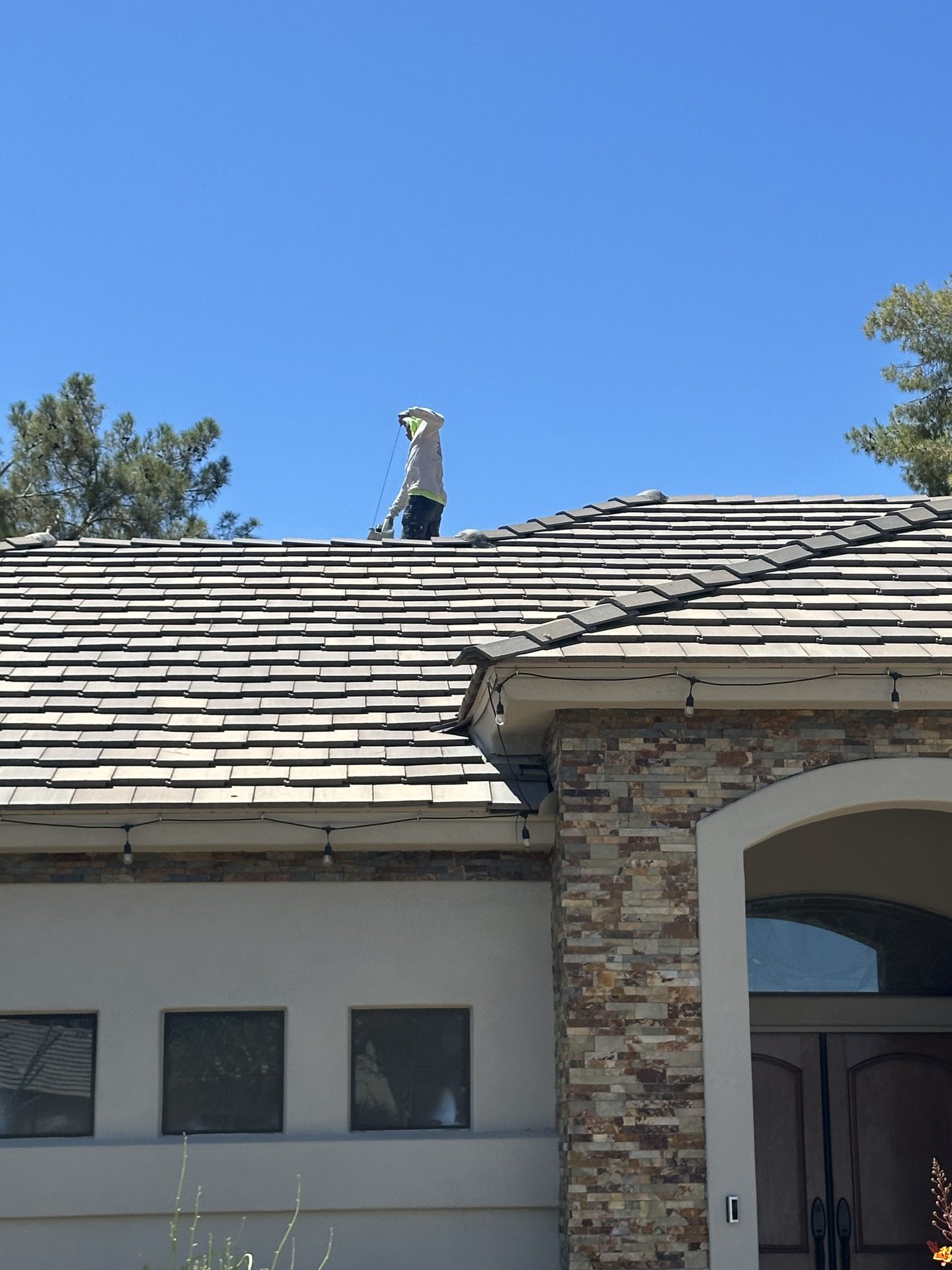 Tile Roof Installation Work Roofer working on a tile roof installation